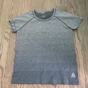 This brand is Reebok! A nice comfy workout type tee!